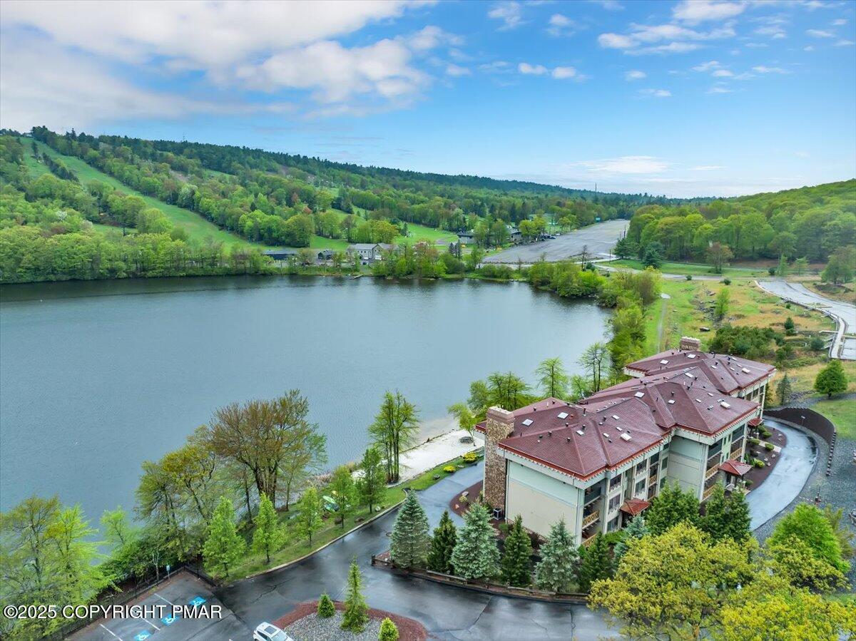 320 Hummingbird Way Lake, Unit 302J1 Lake Harmony, PA 18624 - Photo 26 of 29 an aerial view of a house with garden space and a lake view in back