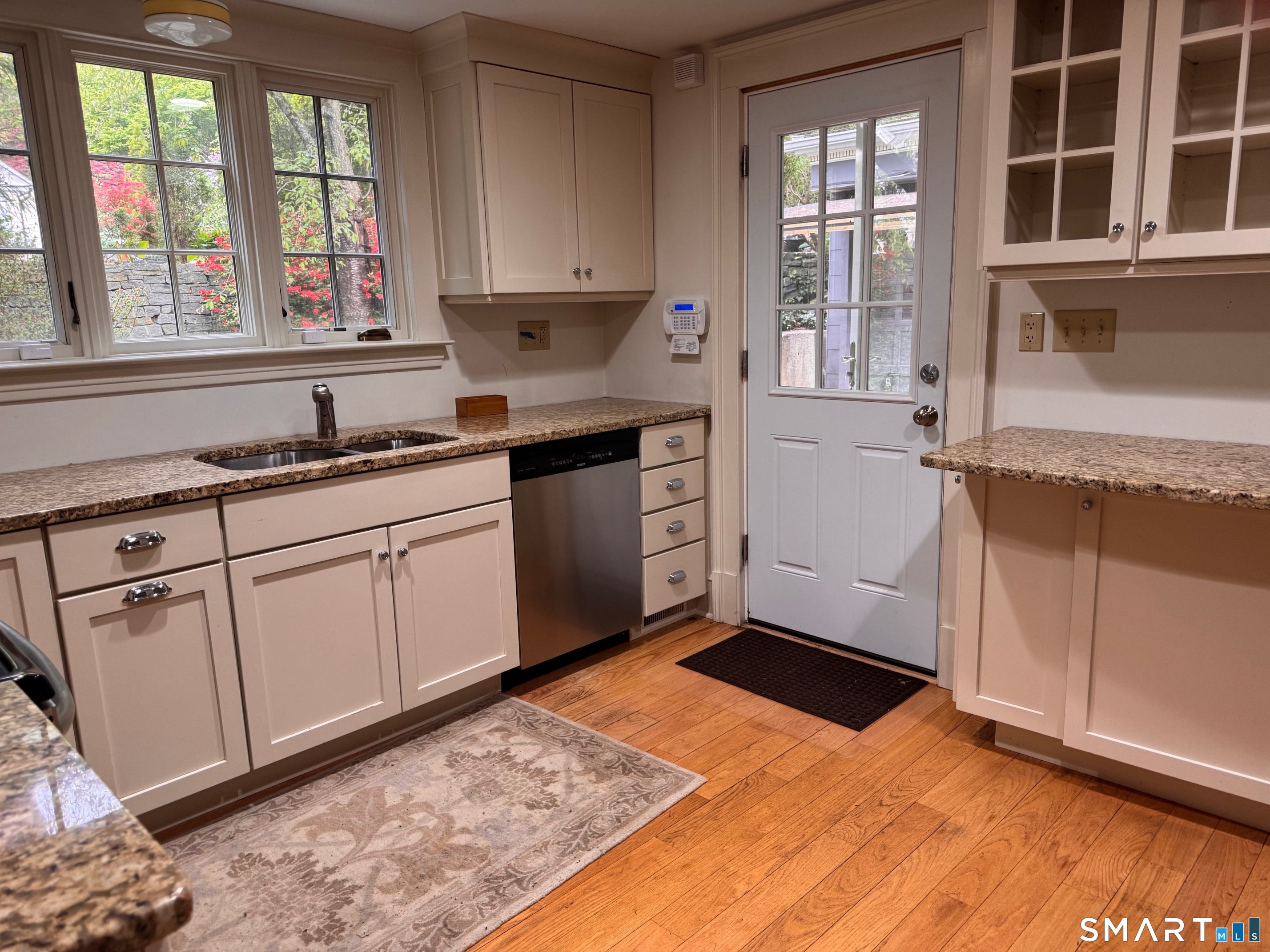 57 Mill Rock Road Hamden, CT 06517 - Photo 11 of 24 a kitchen with granite countertop cabinets stainless steel appliances a sink and a window