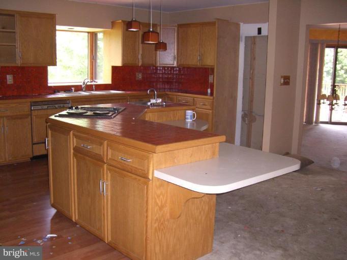 2224 Choate Road Fallston, MD 21047 - Photo 6 of 13 a kitchen with a sink cabinets and window
