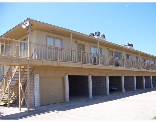 4502 Surfside Boulevard, Unit 8 Corpus Christi, TX 78402 - Photo 3 of 9 a front view of a house with a garage