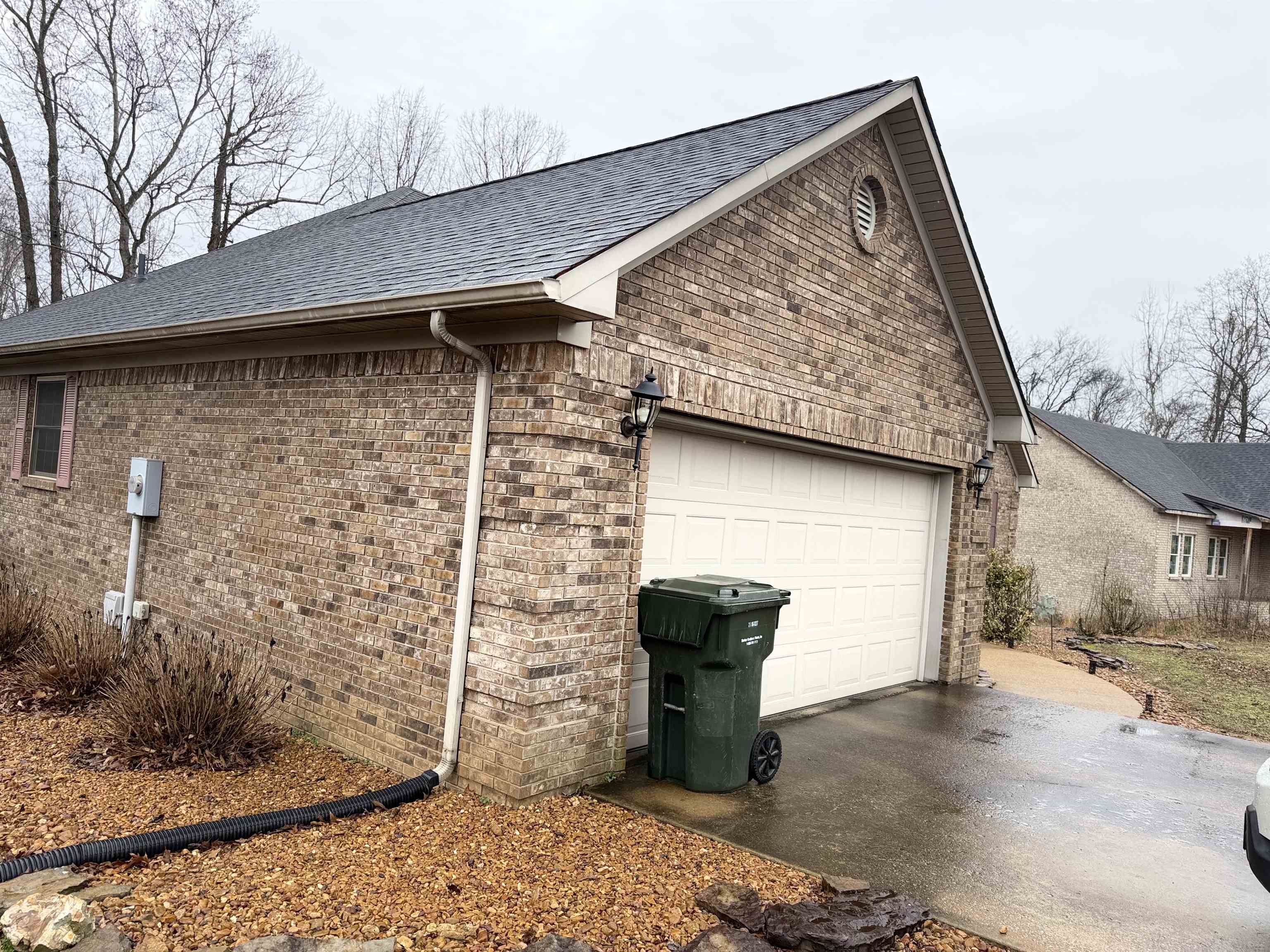 95 Lab Drive Buchanan, TN 38222 - Photo 2 of 19 View of side of property with brick siding, roof with shingles, and driveway