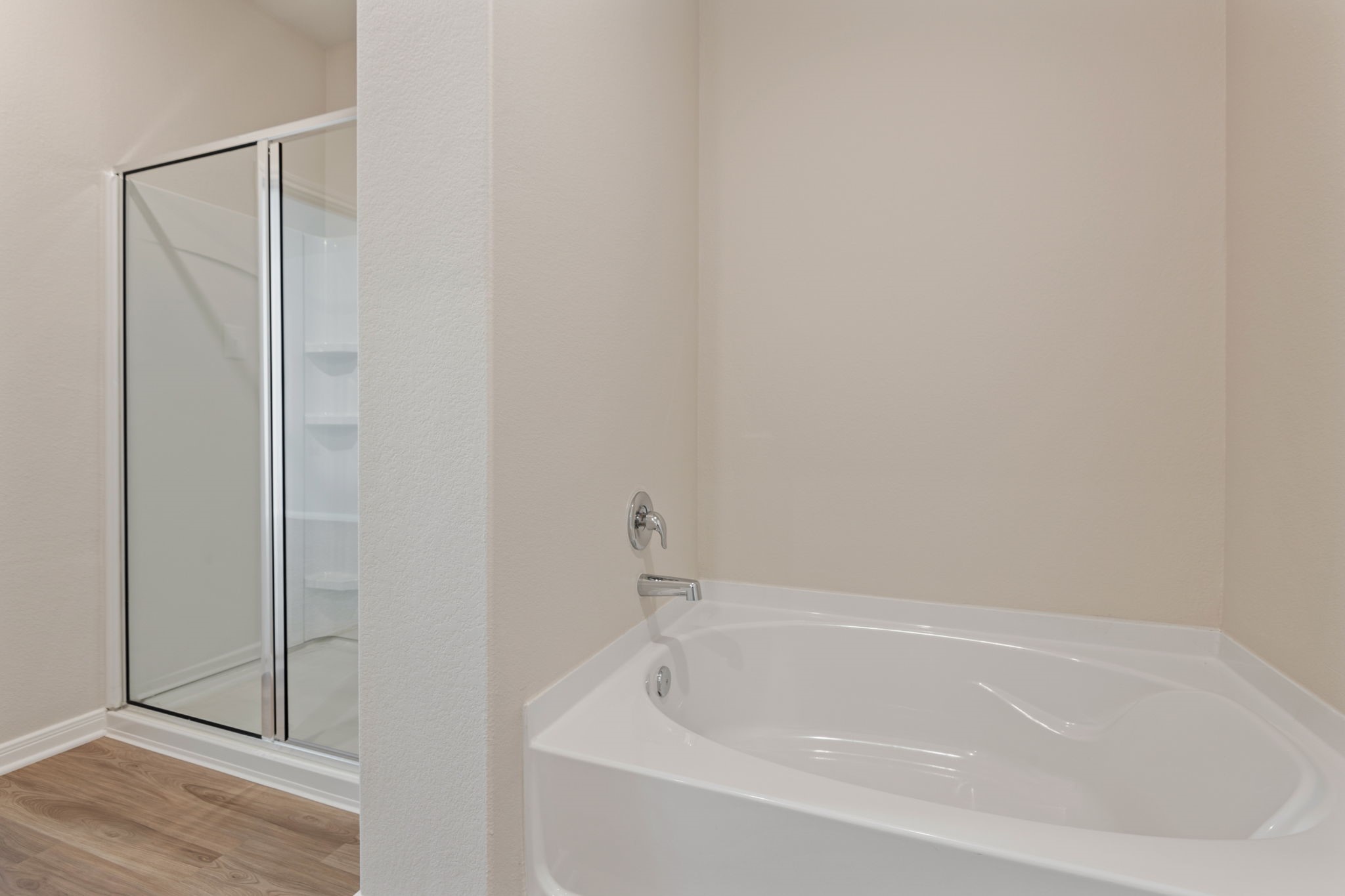 10339 Red Cardinal Drive Cleveland, TX 77328 - Photo 11 of 23 a white bath tub sitting next to a shower