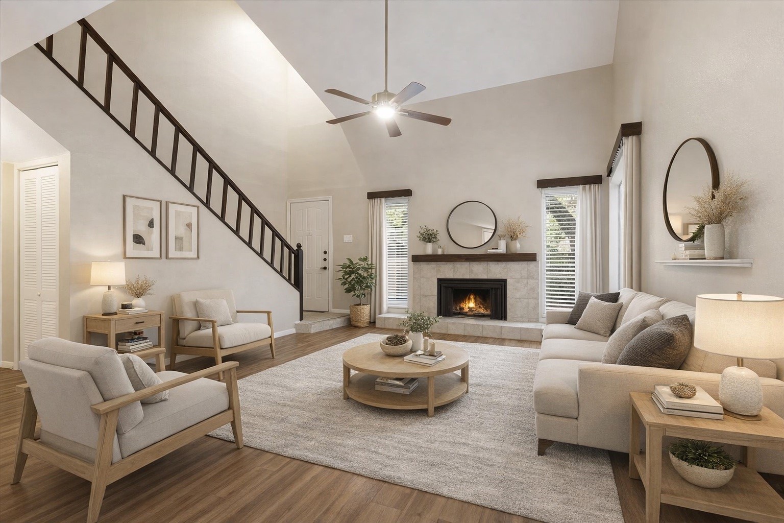 3502 Ocee Street, Unit 3502 Houston, TX 77063 - Photo 1 of 28 This spacious living room features high ceilings, a modern ceiling fan, and a cozy fireplace. The large windows provide ample natural light, and the wood flooring adds warmth. A staircase leads to the upper level, enhancing the open feel of the space. (Virtually staged)