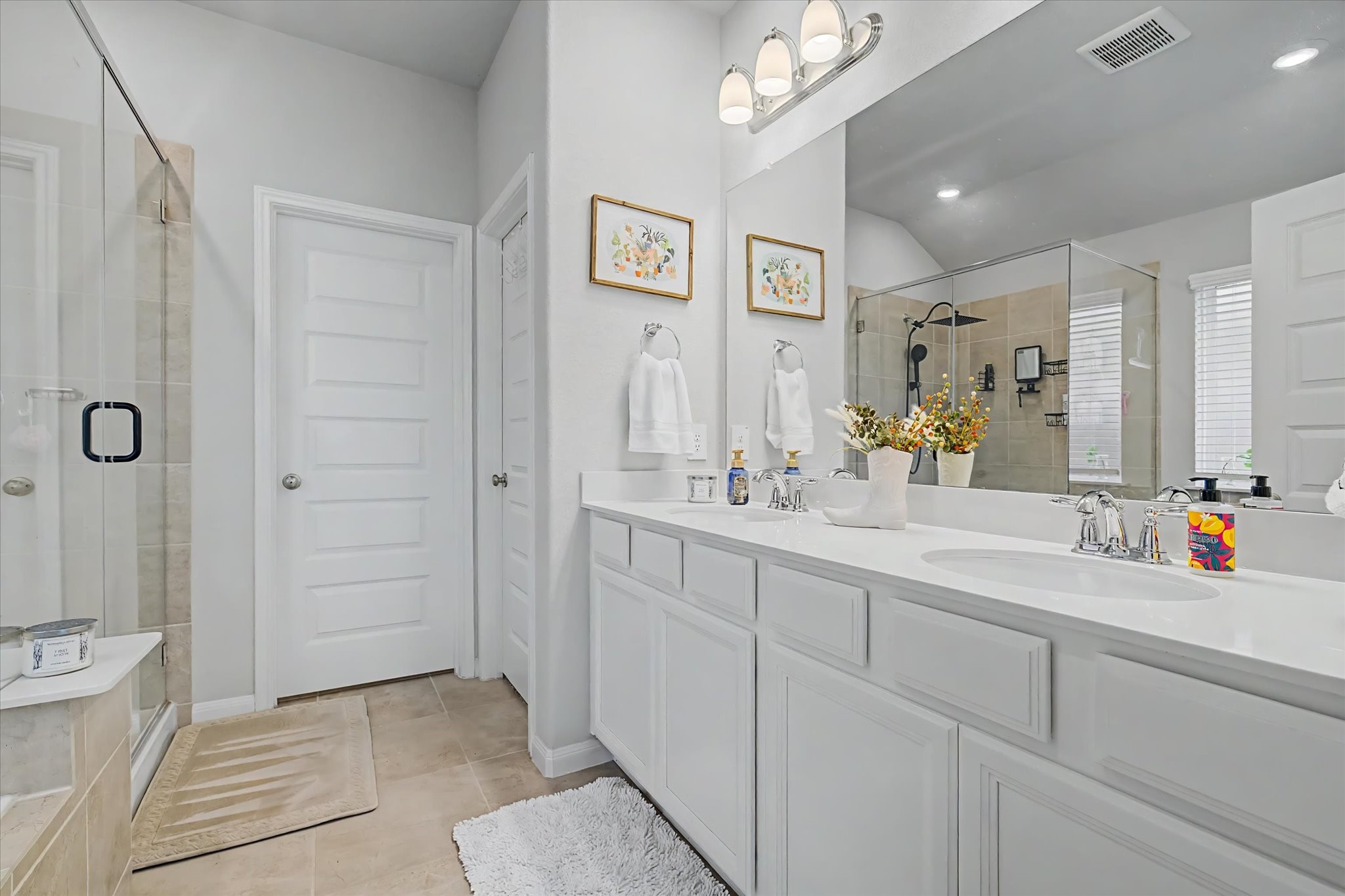 10842 Cliffs View Drive Iowa Colony, TX 77583 - Photo 21 of 47 Primary bathroom features dual vanities.