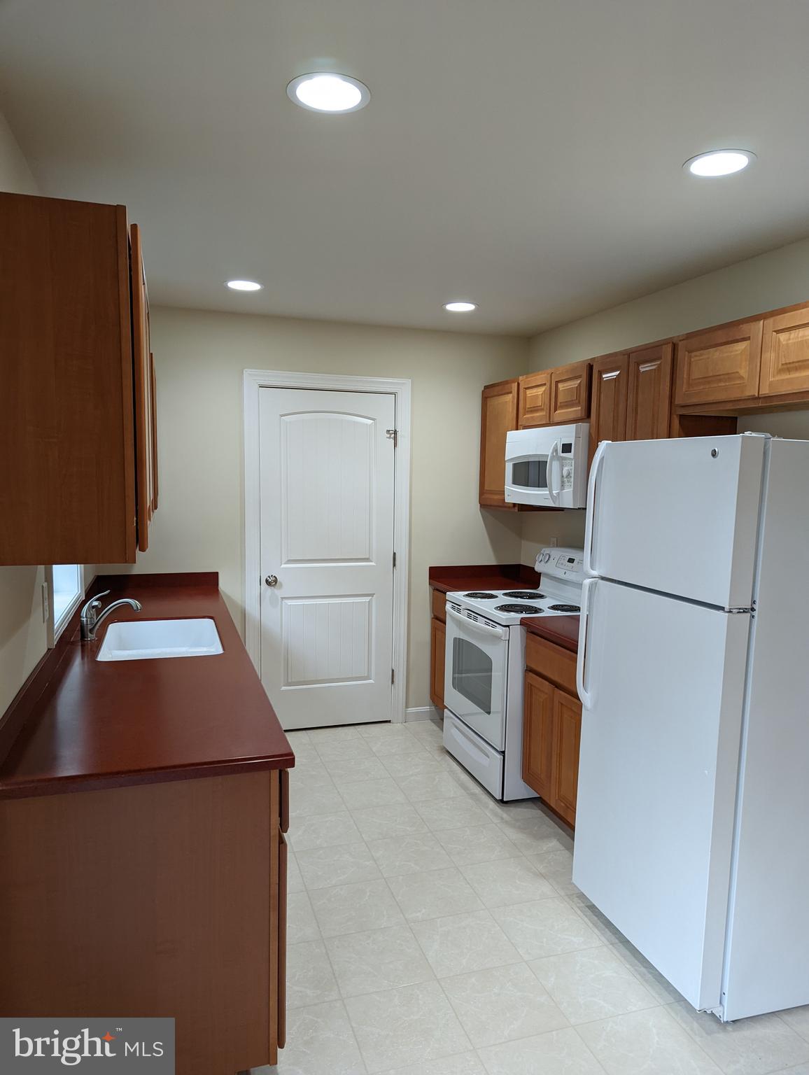 1941 Windswept Drive Dover, DE 19901 - Photo 14 of 34 a kitchen with a refrigerator sink and stove