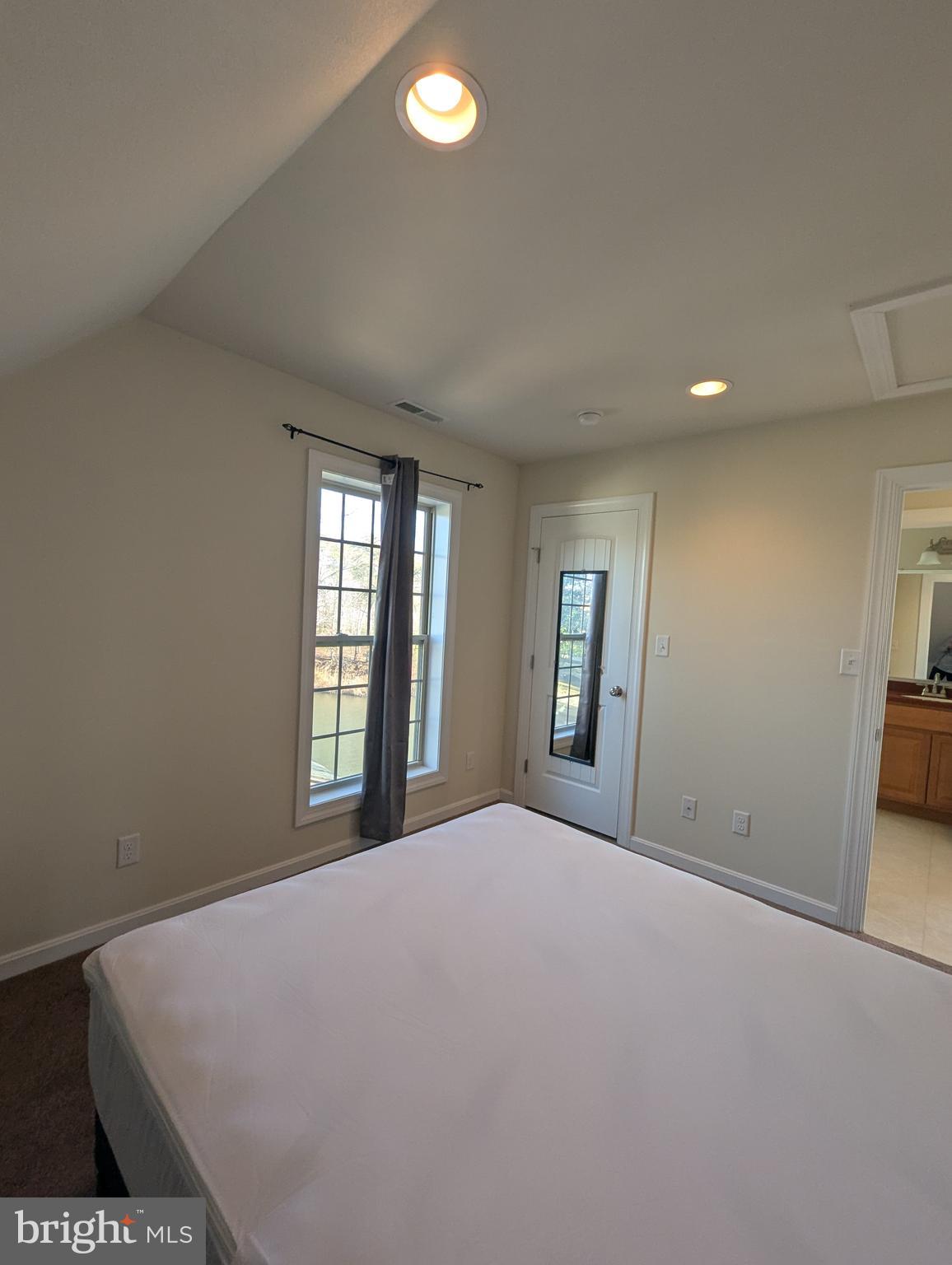 1941 Windswept Drive Dover, DE 19901 - Photo 27 of 34 a large bed sitting in a spacious bedroom next to a window