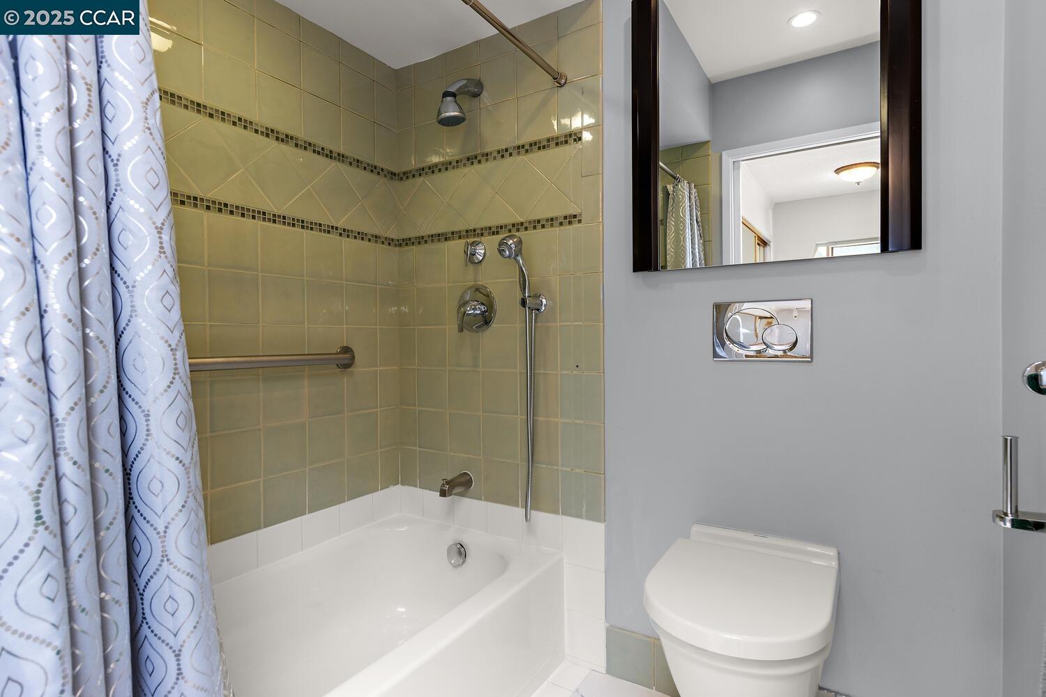 1244 Singingwood Court, Unit 1 Walnut Creek, CA 94595 - Photo 21 of 46 a bathroom with a toilet sink and shower