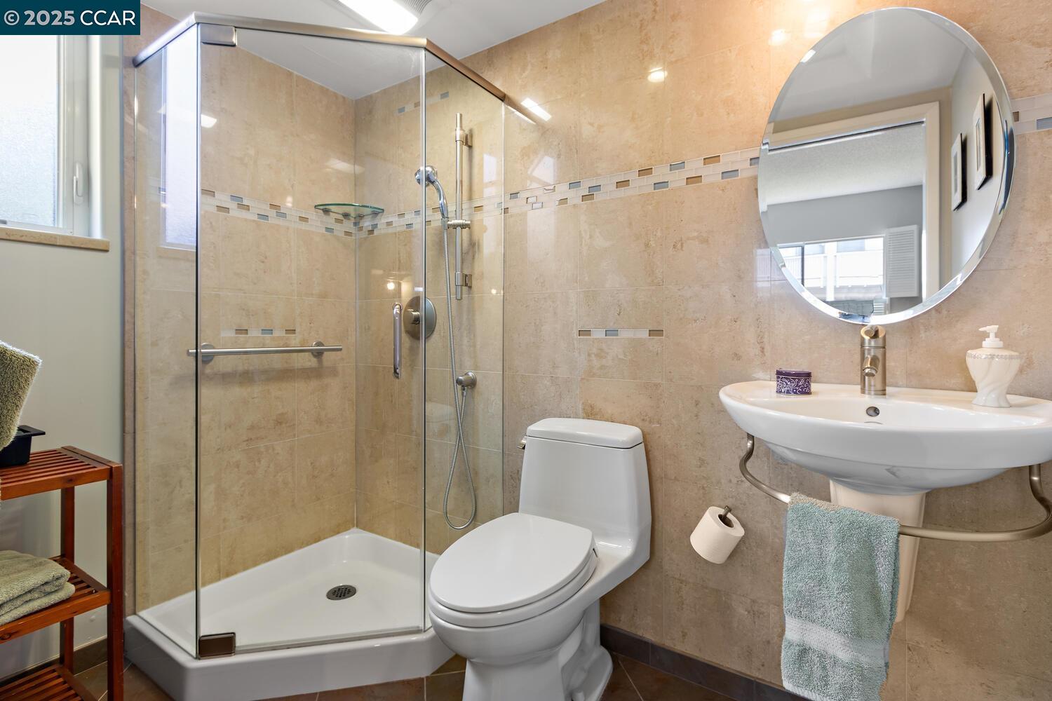 1244 Singingwood Court, Unit 1 Walnut Creek, CA 94595 - Photo 25 of 46 a bathroom with a sink toilet and shower