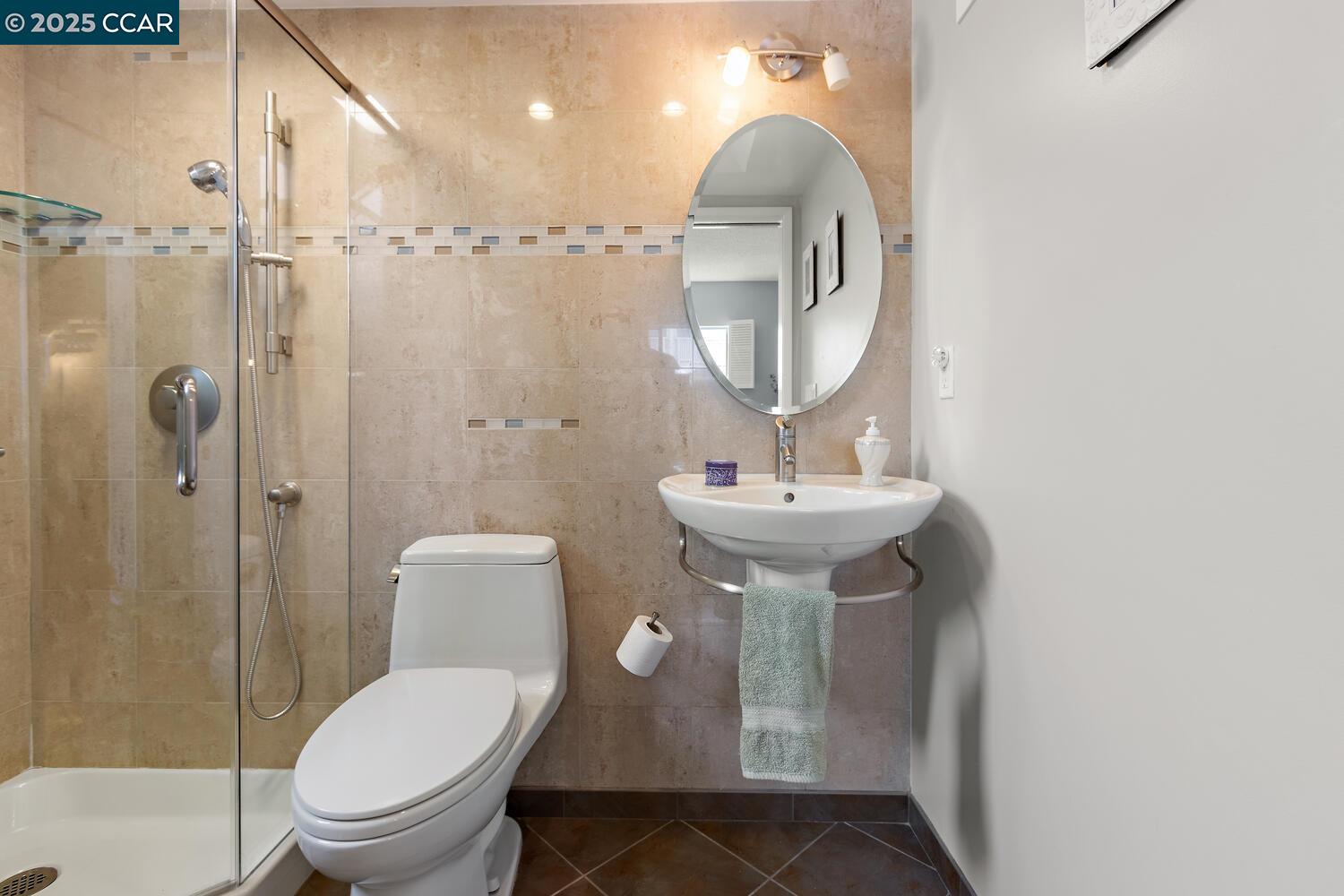 1244 Singingwood Court, Unit 1 Walnut Creek, CA 94595 - Photo 37 of 46 a bathroom with a sink toilet and shower