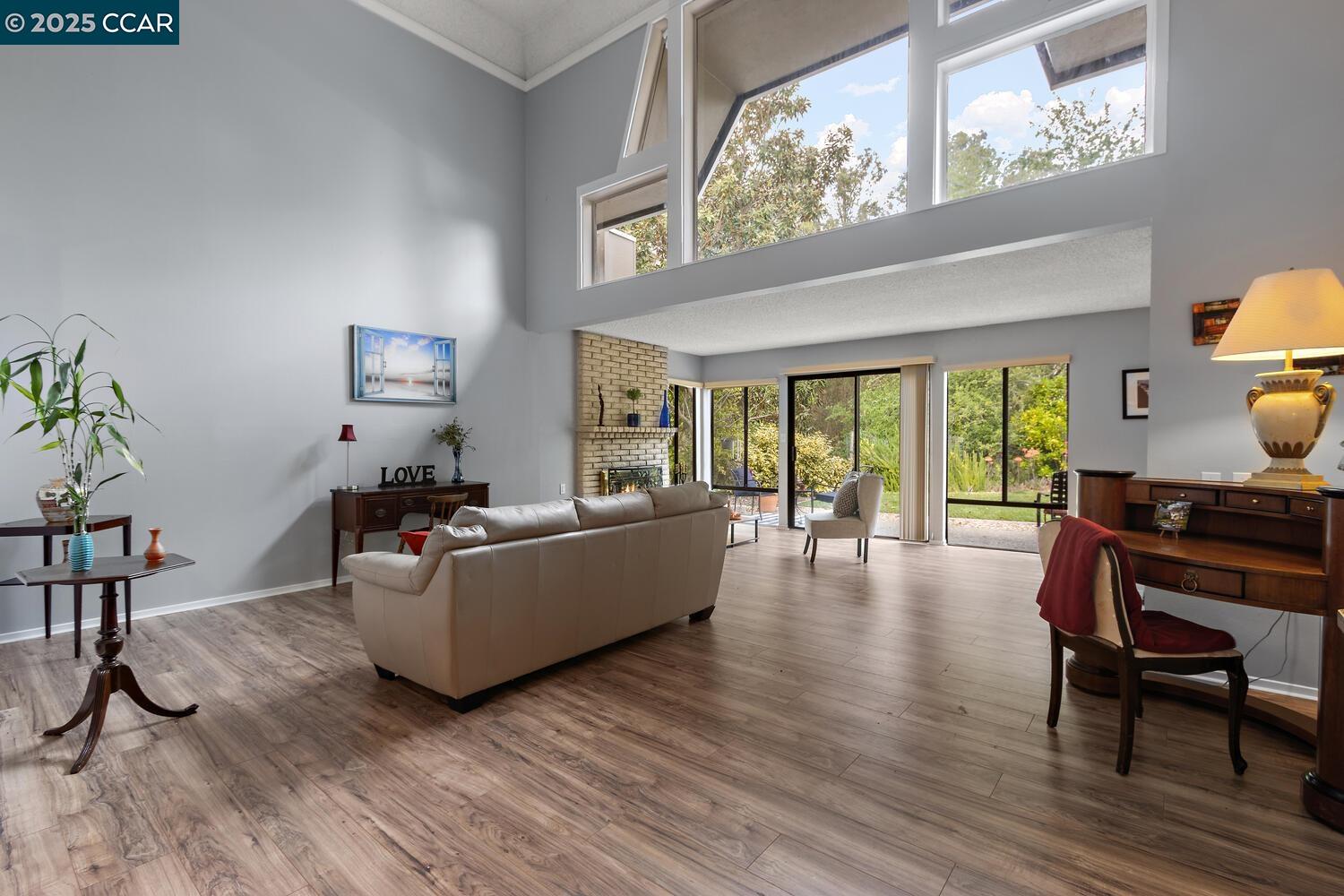 1244 Singingwood Court, Unit 1 Walnut Creek, CA 94595 - Photo 4 of 46 a living room with furniture and a wooden floor