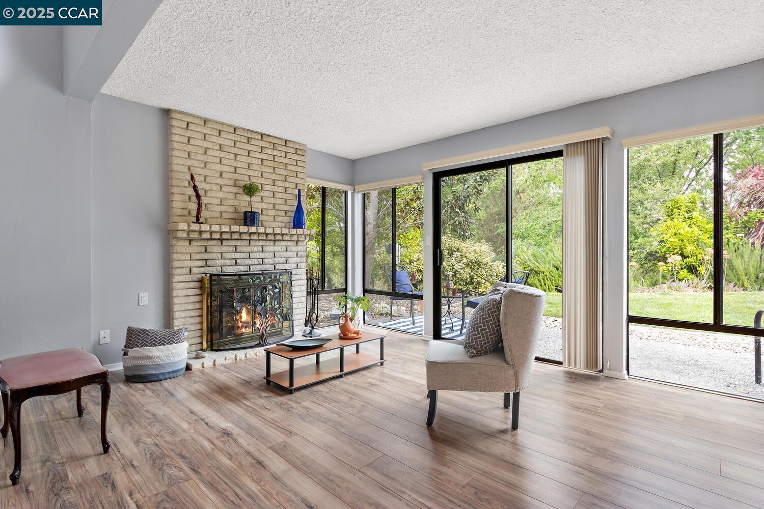 1244 Singingwood Court, Unit 1 Walnut Creek, CA 94595 - Photo 6 of 46 a living room with furniture and a fireplace