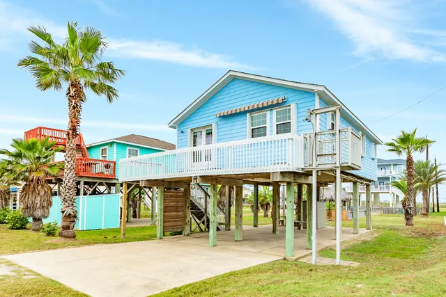 a view of house with deck and outdoor seating