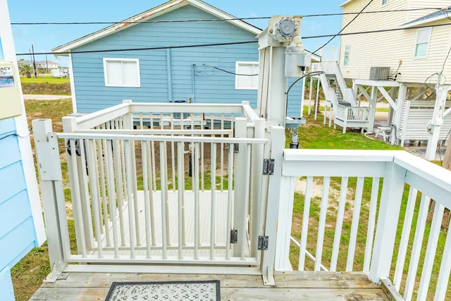 a front view of house with a garden and patio