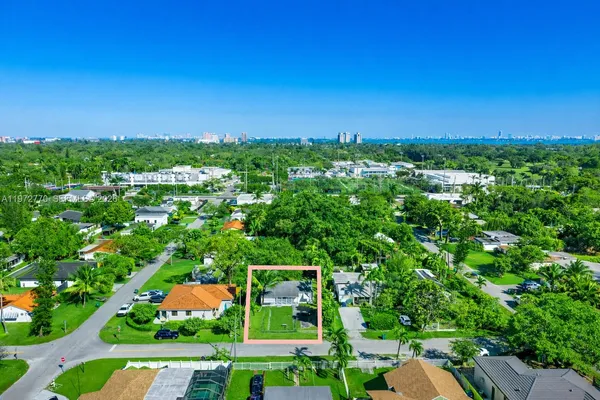 an aerial view of residential house with outdoor space and street view