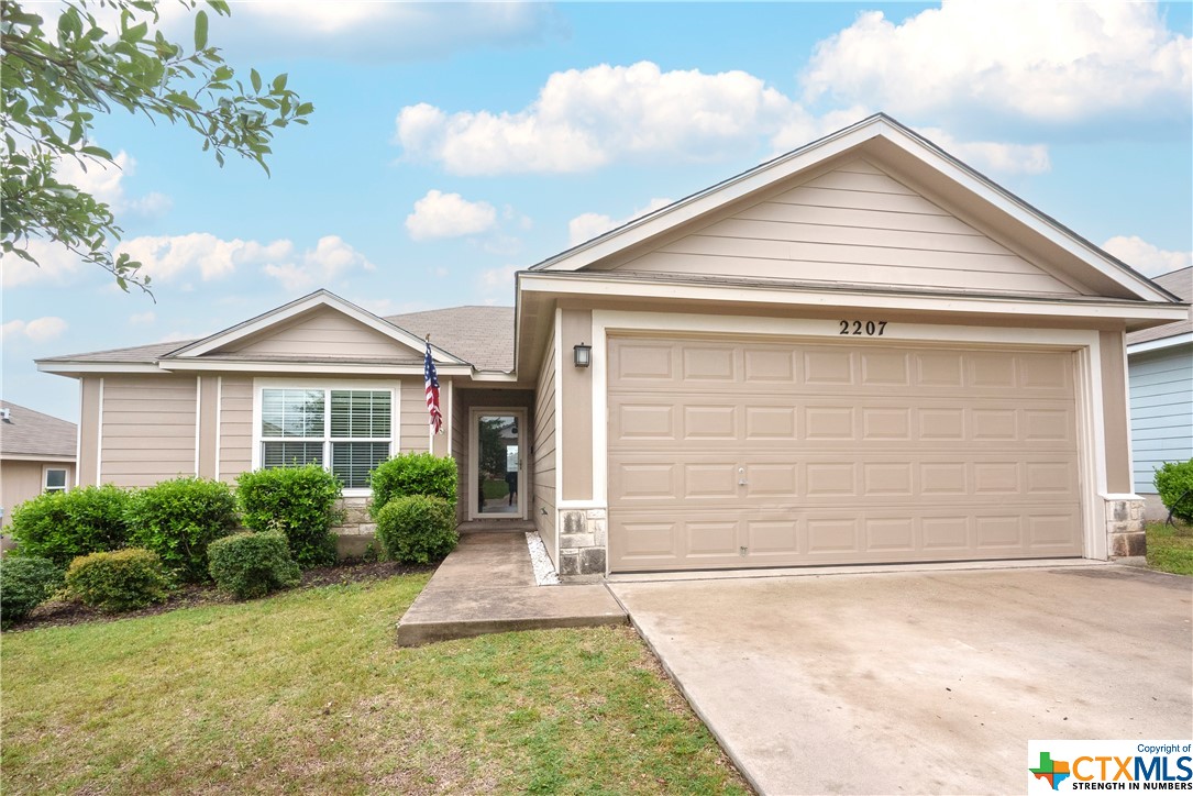 2207 Stoneham Temple, TX 76504 - Photo 1 of 1 a front view of a house with a yard and garage