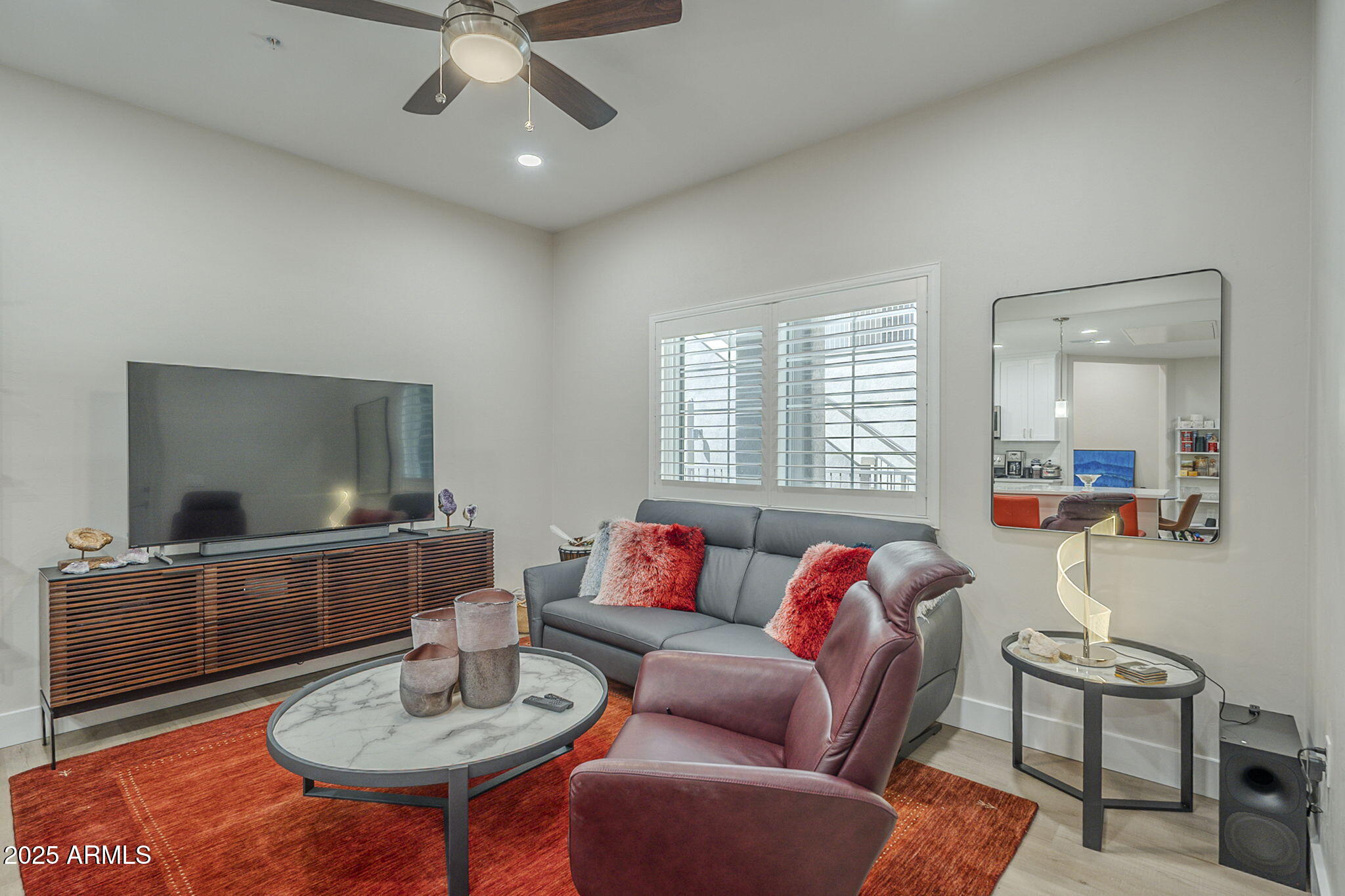 2038 East River Road, Unit 101 Tucson, AZ 85718 - Photo 10 of 21 a living room with furniture and a flat screen tv