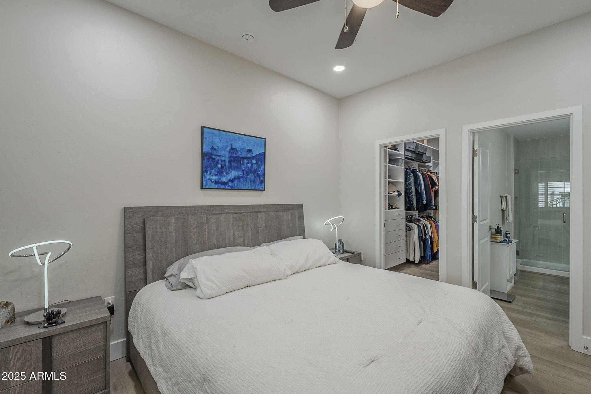 2038 East River Road, Unit 101 Tucson, AZ 85718 - Photo 11 of 21 a bedroom with a bed and a table