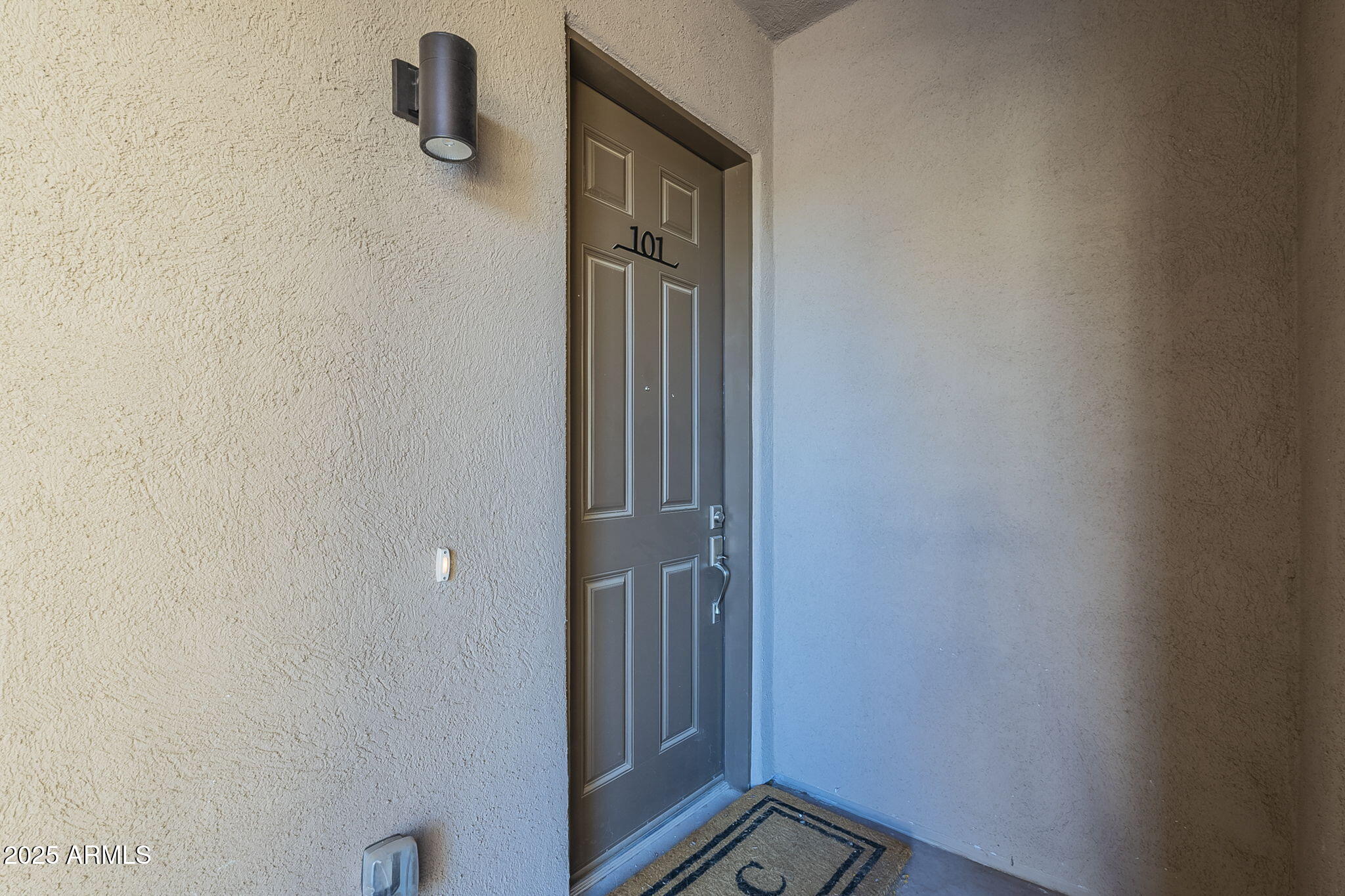 2038 East River Road, Unit 101 Tucson, AZ 85718 - Photo 17 of 21 a view of a livingroom from a door