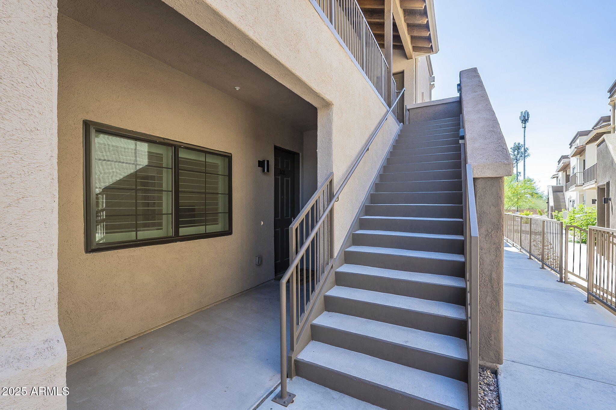 2038 East River Road, Unit 101 Tucson, AZ 85718 - Photo 18 of 21 a view of entryway and hall with wooden floor