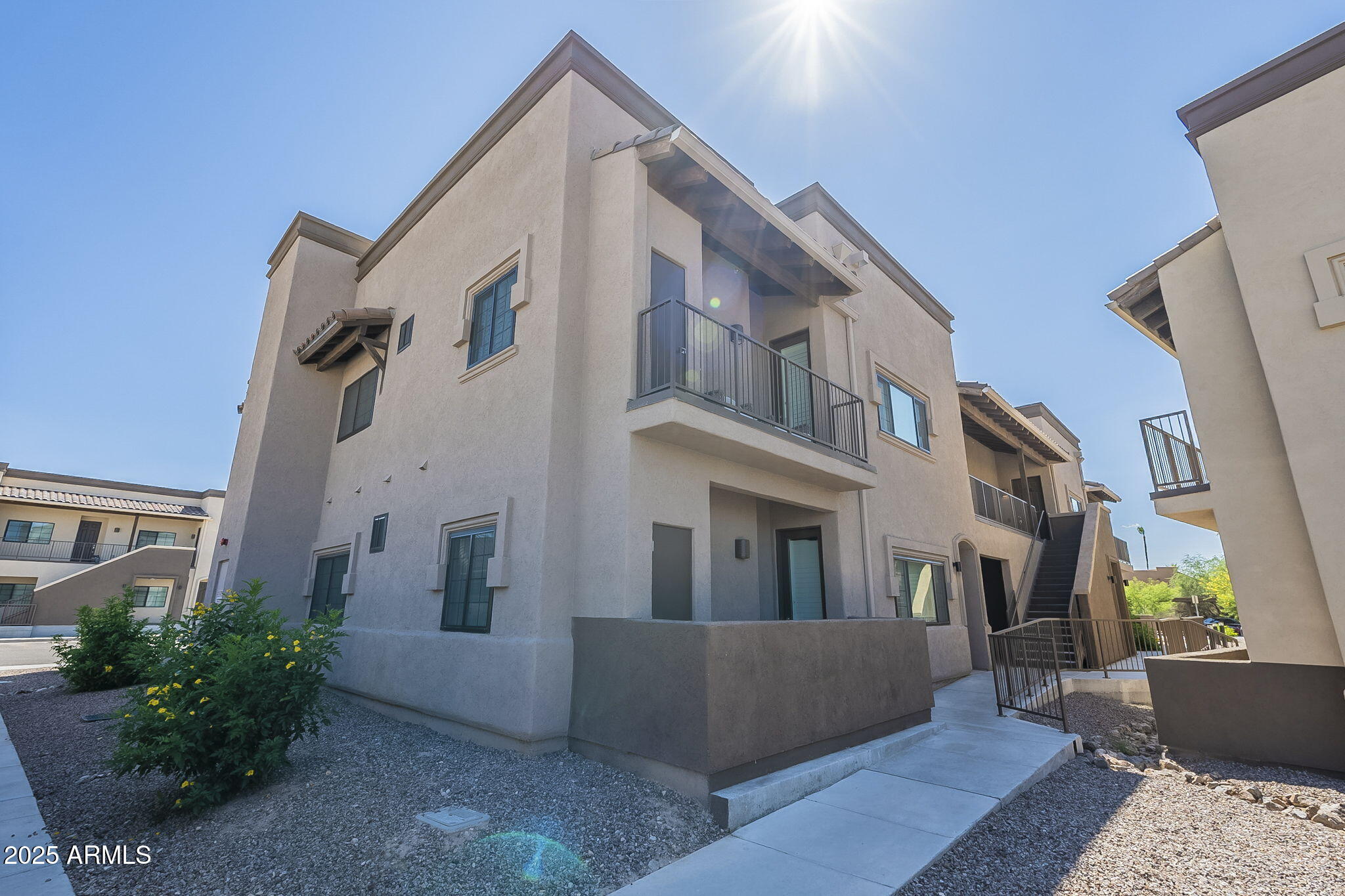 2038 East River Road, Unit 101 Tucson, AZ 85718 - Photo 19 of 21 a view of a building from a patio
