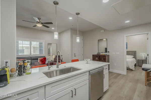 a kitchen with a table chairs stove and cabinets
