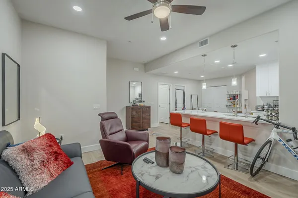 a large kitchen with a table and chairs