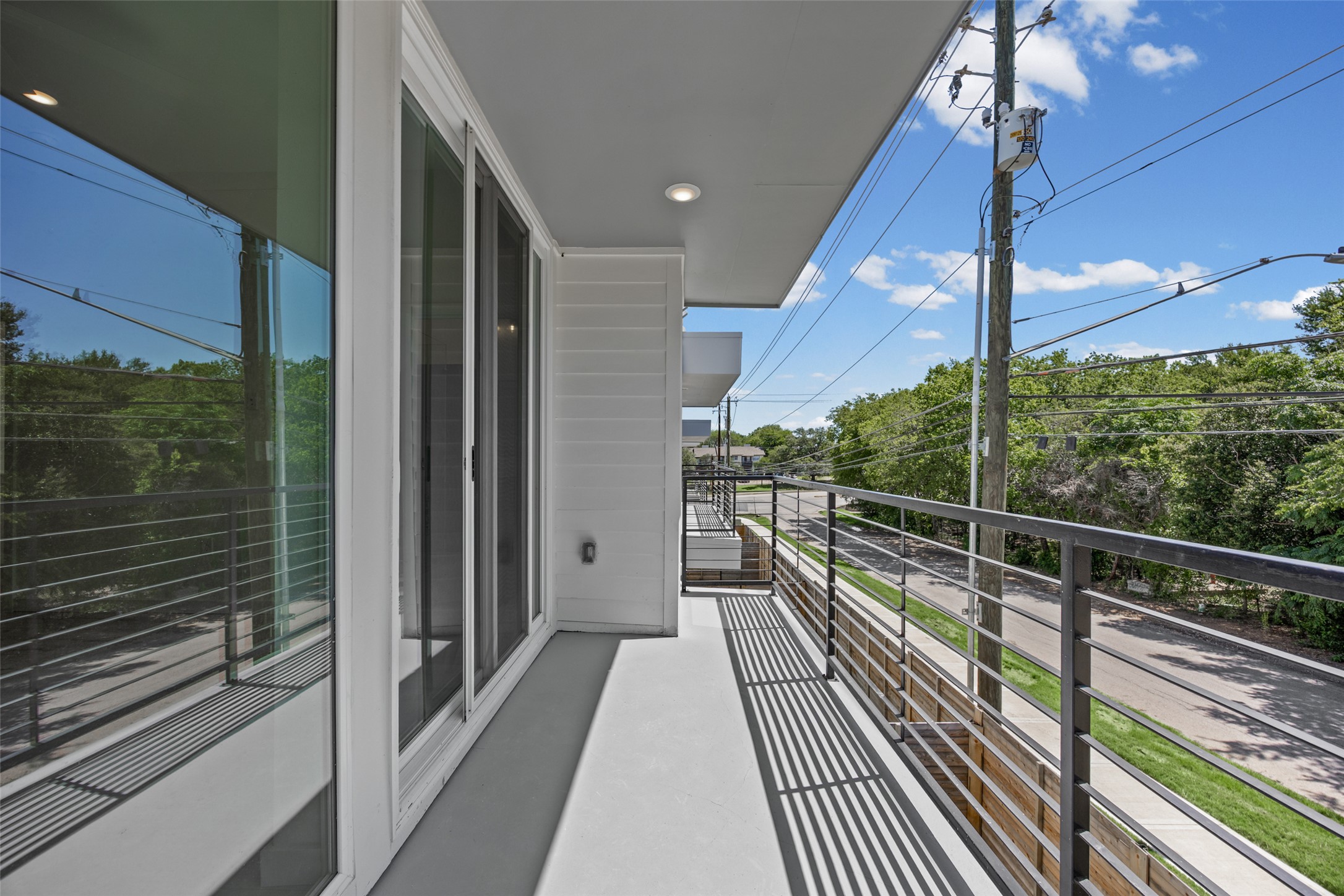 2000 Riverside Farms Road, Unit 5102 Austin, TX 78741 - Photo 17 of 25 A private balcony offers serene views of the surrounding tree-lined neighborhood.
