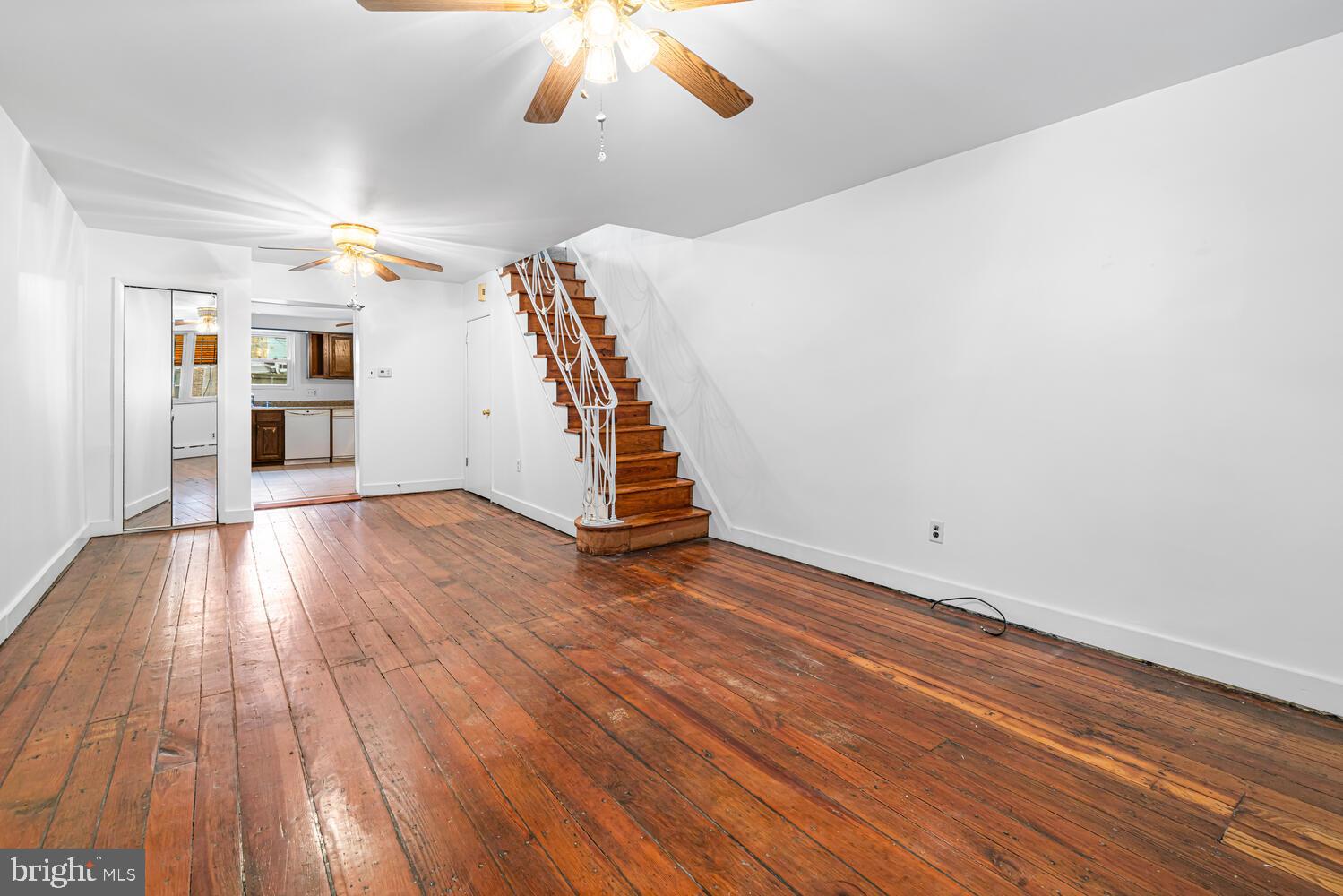 809 McClellan Street Philadelphia, PA 19148 - Photo 2 of 25 Spacious living area with charming staircase.