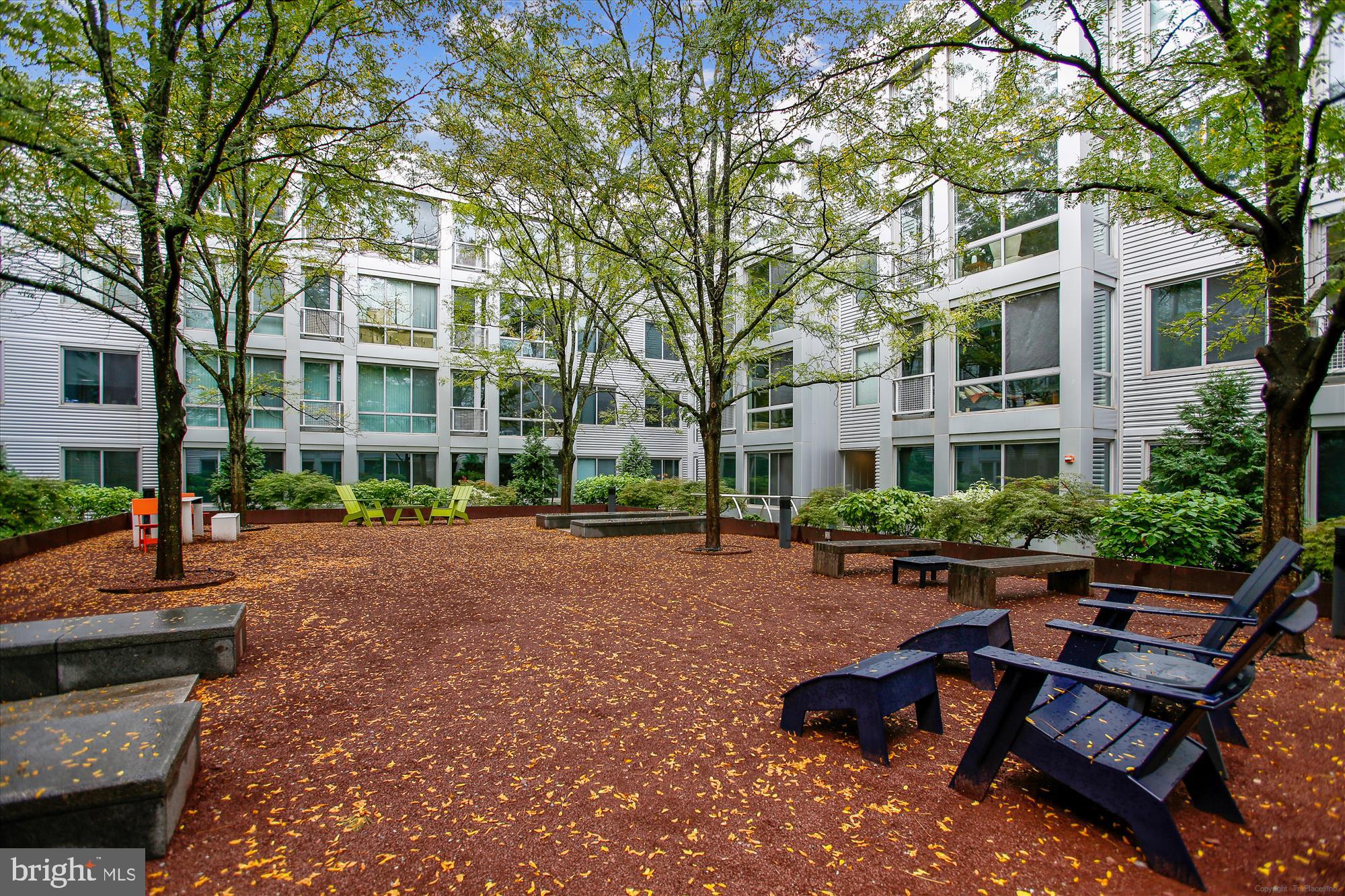 4101 Albemarle Street Northwest, Unit 623 Washington, DC 20016 - Photo 23 of 25 a view of a building with yard and sitting area