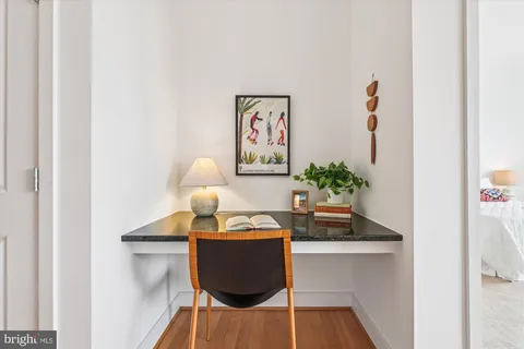 a view of a workspace with furniture