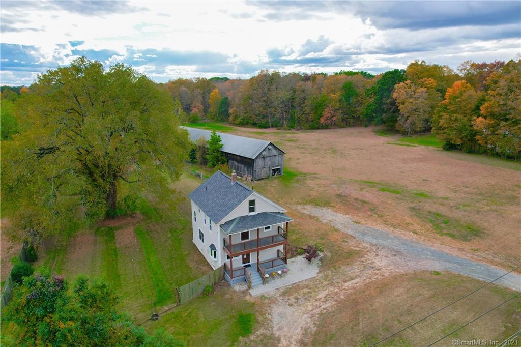 1005 Mountain Road Suffield, CT 06093 - Photo 1 of 1 an aerial view of a house with a garden