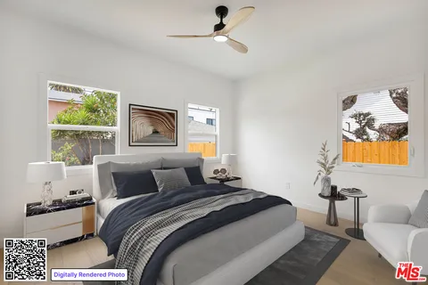 a bedroom with a bed and a couch