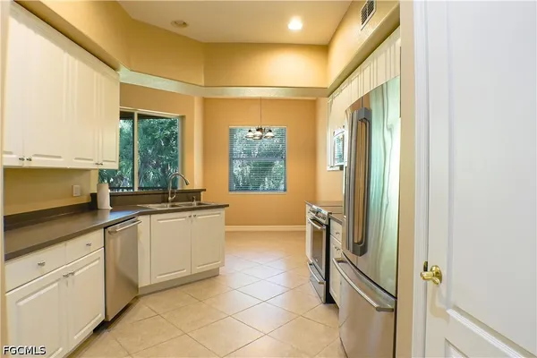 a large bathroom with a large mirror vanity and shower