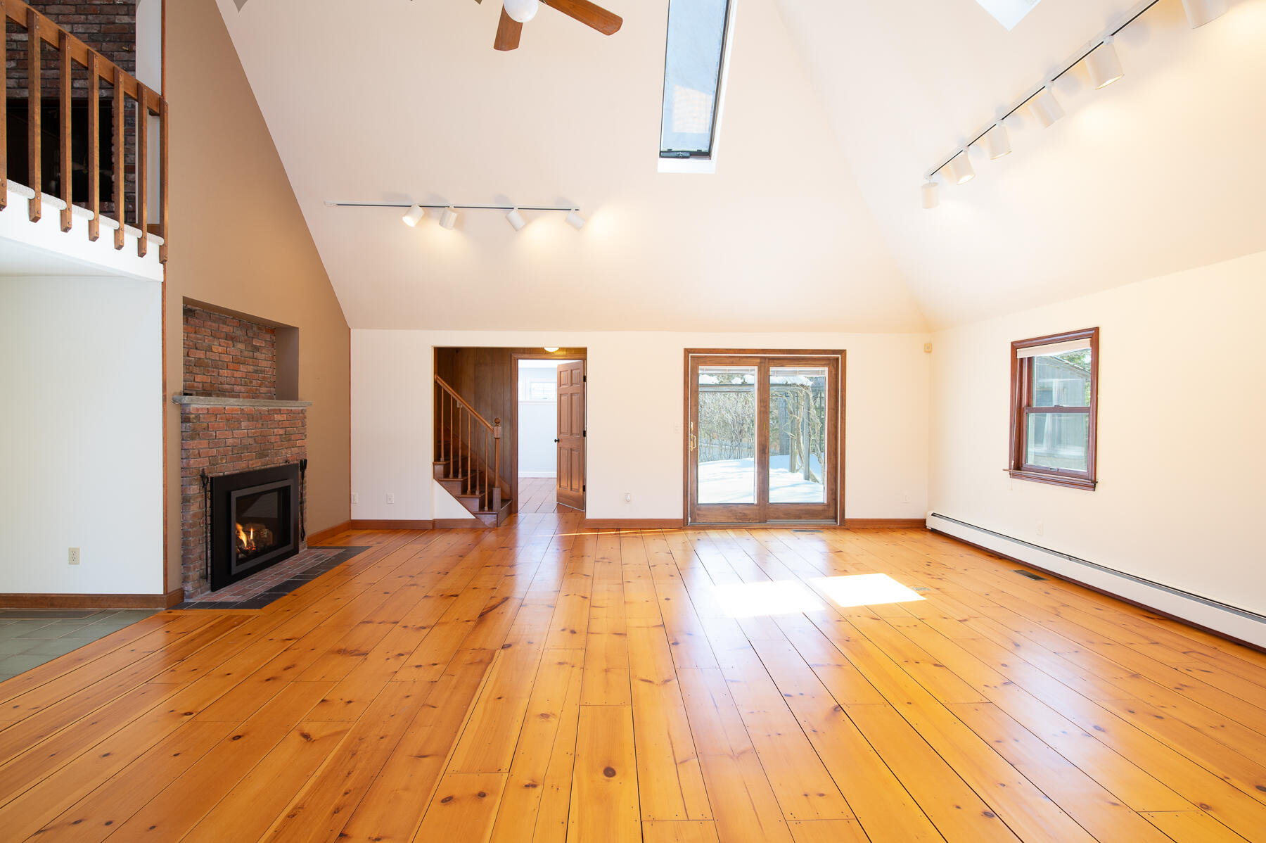 16 Meltiah Road Falmouth, MA 02540 - Photo 11 of 64 a view of an empty room with window and wooden floor
