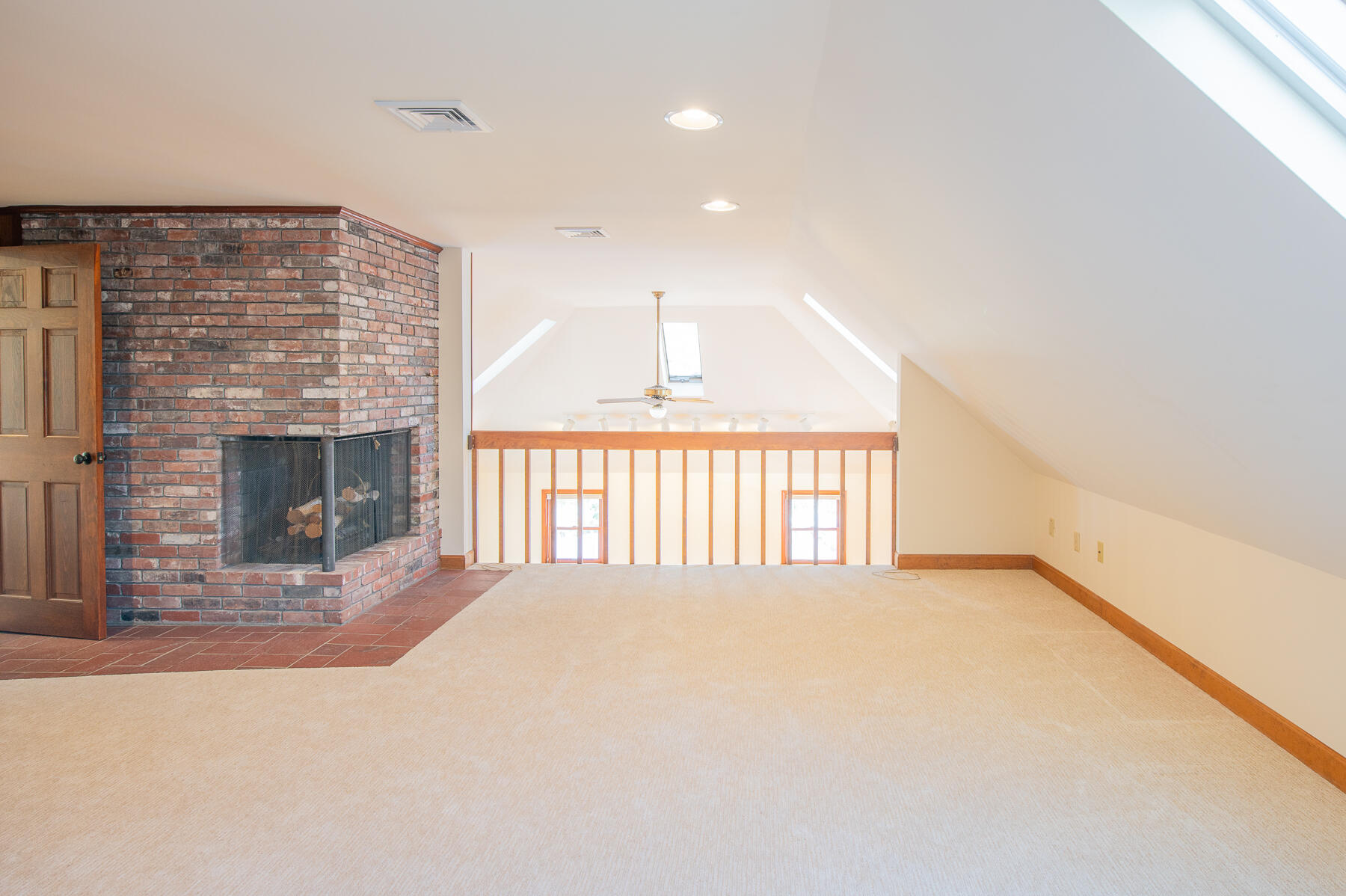 16 Meltiah Road Falmouth, MA 02540 - Photo 37 of 64 a view of an empty room with a fireplace and a window
