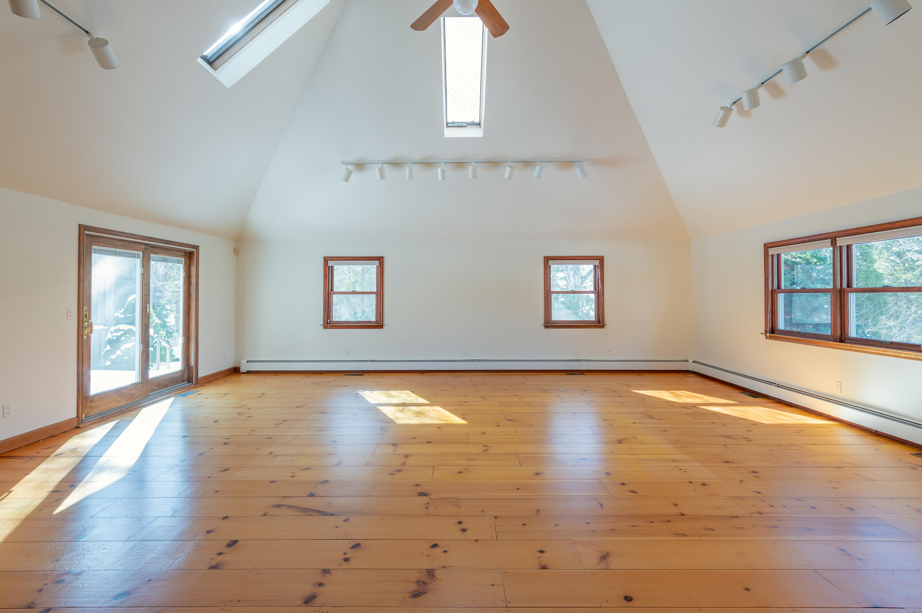 16 Meltiah Road Falmouth, MA 02540 - Photo 9 of 64 an empty room with wooden floor and windows