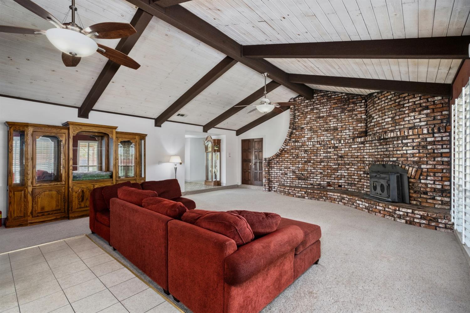 3140 North Temperance Avenue Clovis, CA 93611 - Photo 14 of 36 a living room with furniture a fireplace and a flat screen tv