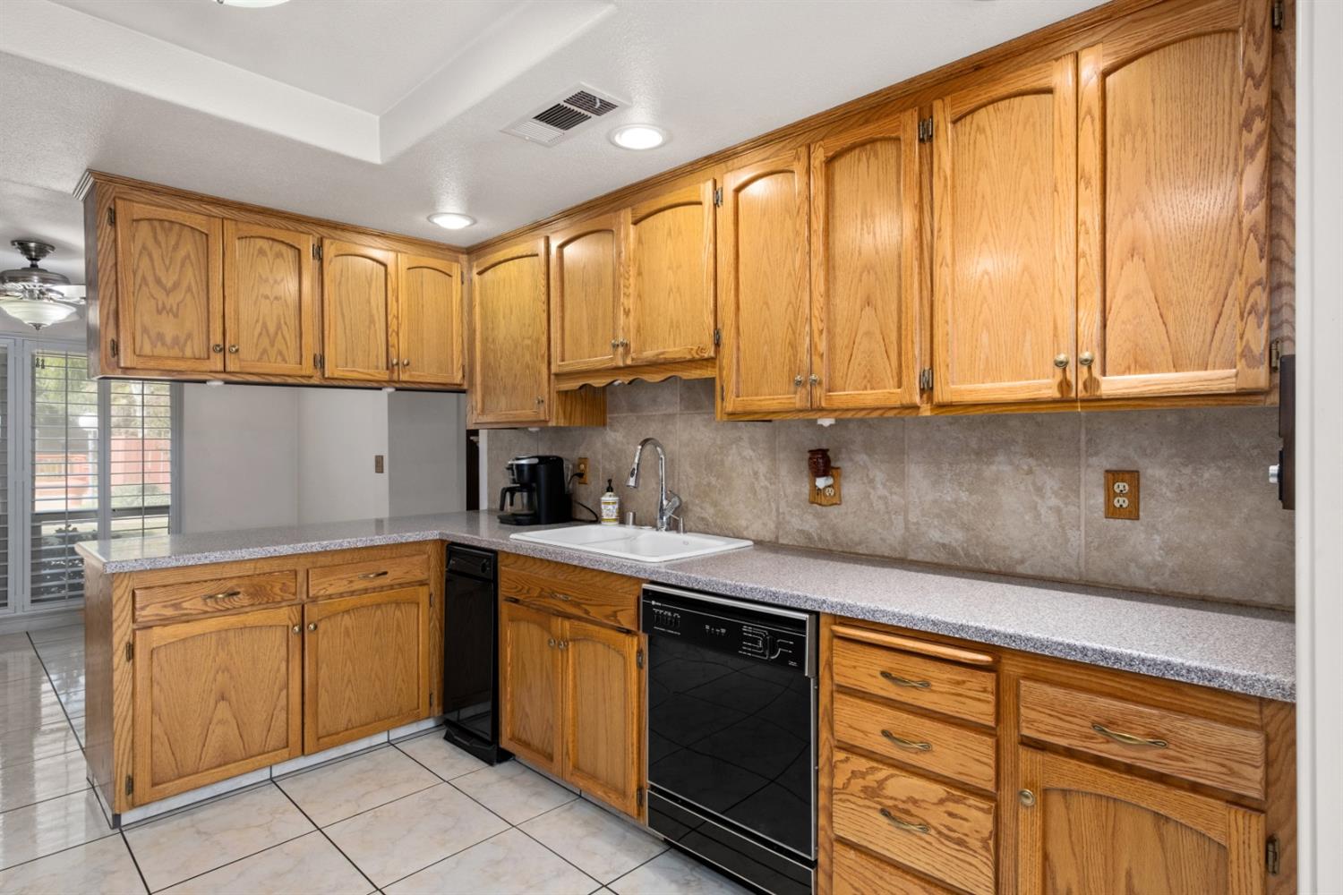 3140 North Temperance Avenue Clovis, CA 93611 - Photo 17 of 36 a kitchen with stainless steel appliances granite countertop a sink a stove and cabinets