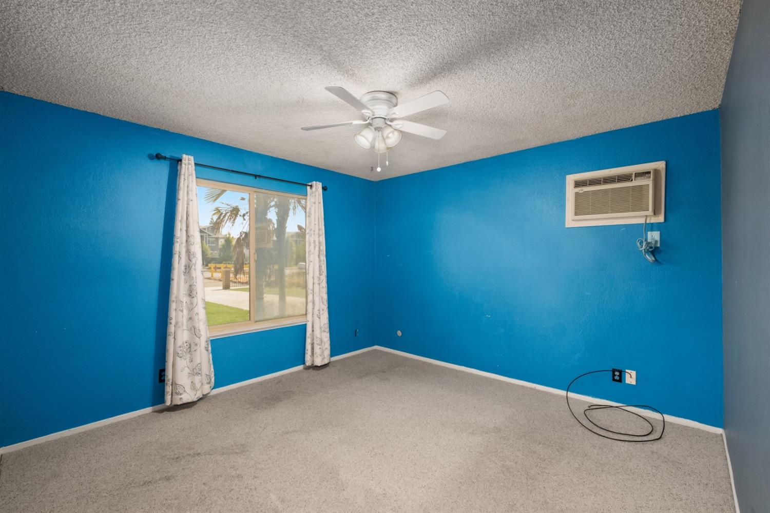 3140 North Temperance Avenue Clovis, CA 93611 - Photo 27 of 36 an empty room with windows and fan