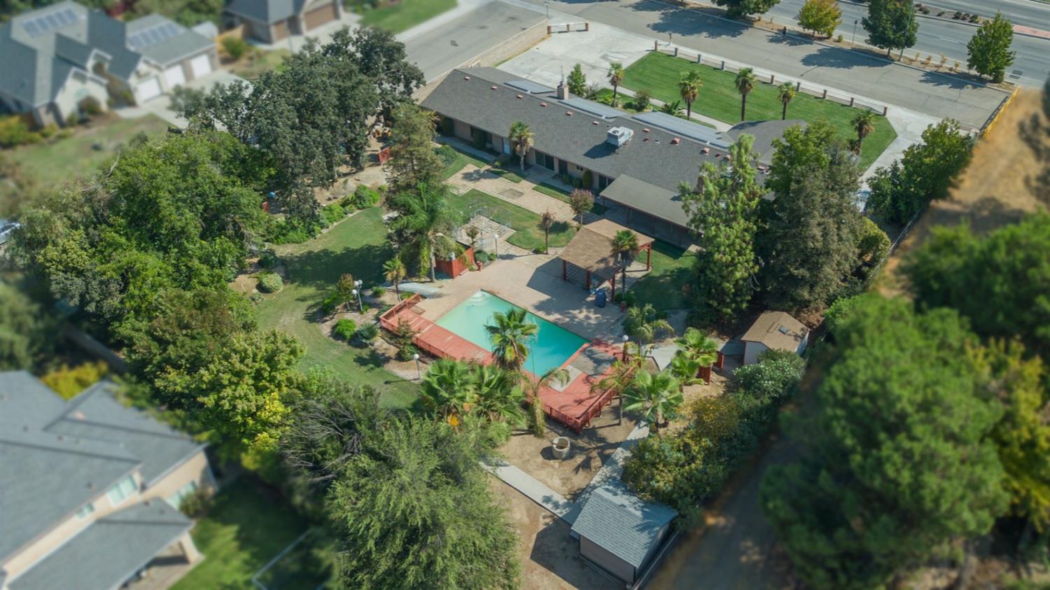 3140 North Temperance Avenue Clovis, CA 93611 - Photo 7 of 36 an aerial view of a house with a yard