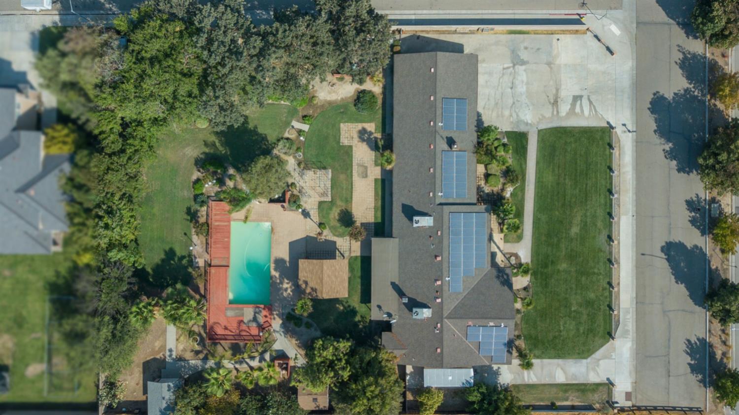 3140 North Temperance Avenue Clovis, CA 93611 - Photo 8 of 36 an aerial view of a house with a backyard