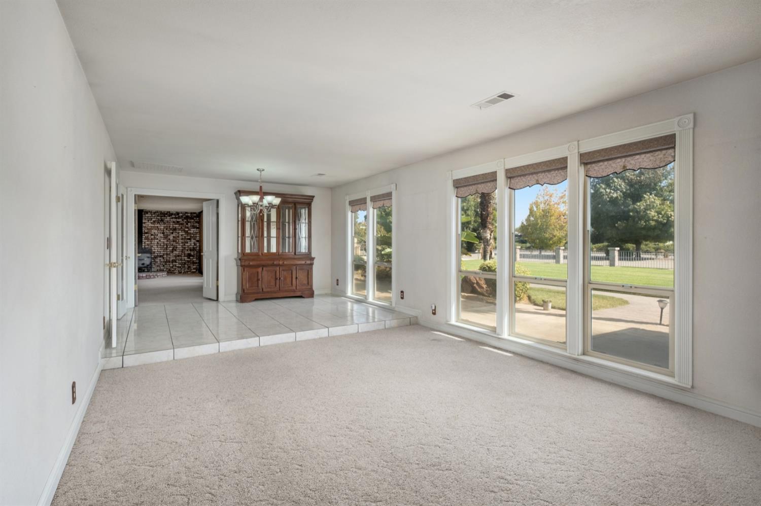 3140 North Temperance Avenue Clovis, CA 93611 - Photo 9 of 36 a view of an empty room with glass door