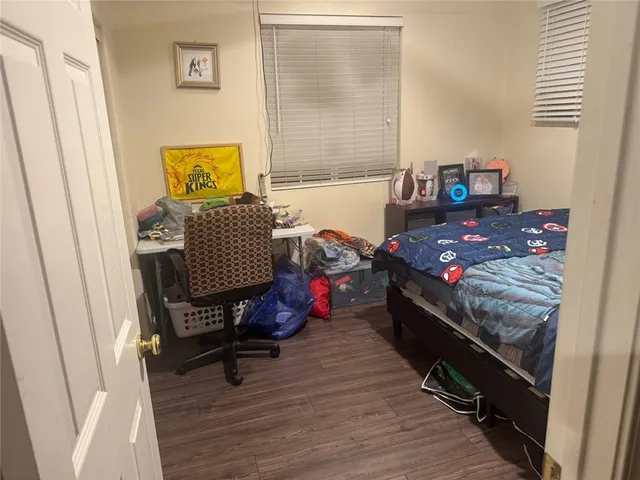 a view of a bedroom with a bed