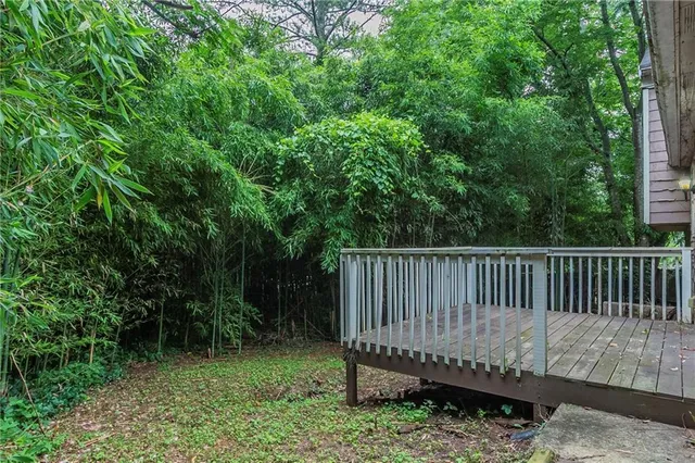 a view of a backyard with a small deck