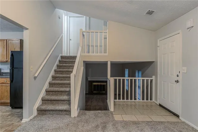 a view of a hallway with stairs
