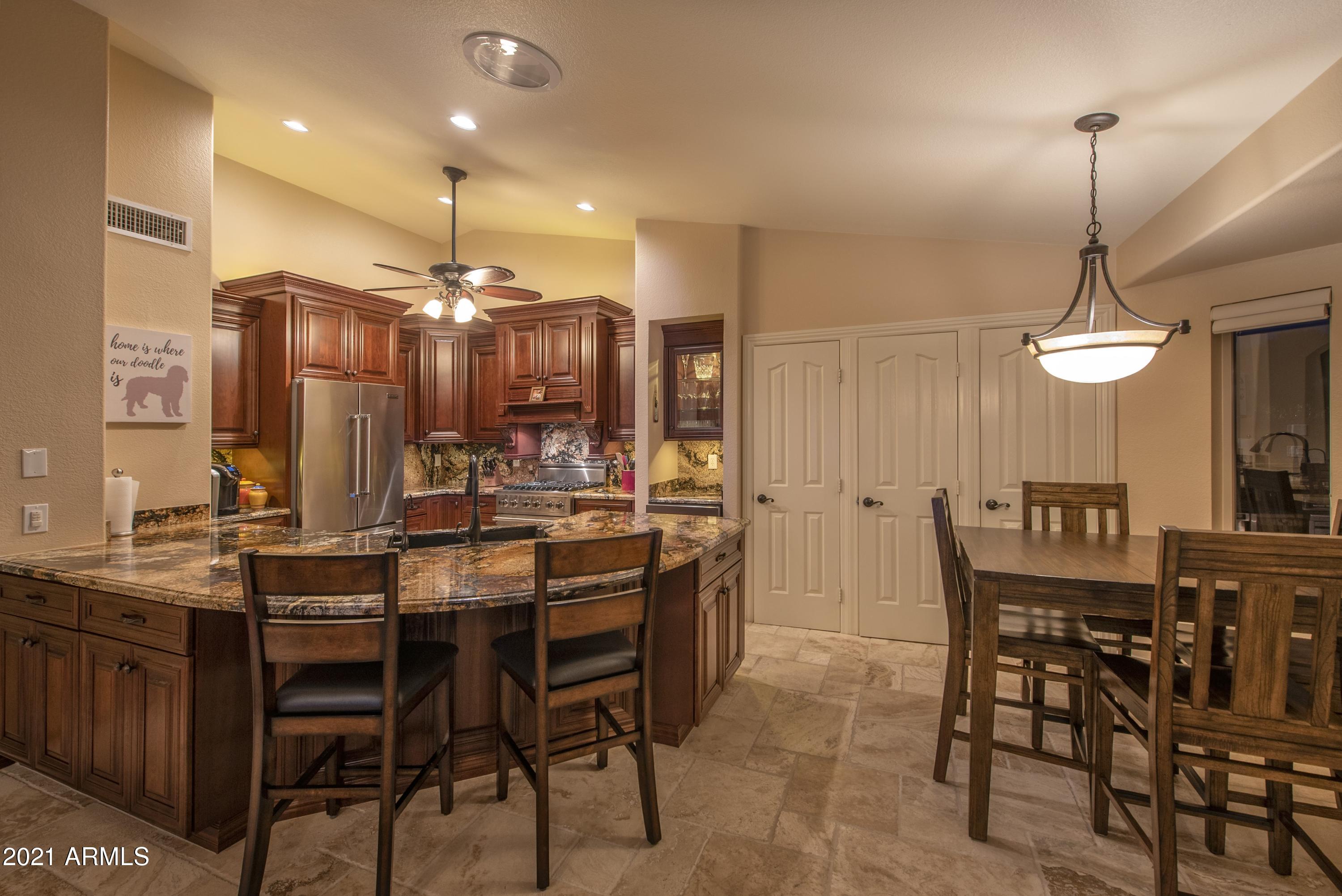 14803 Piccadilly Road Goodyear, AZ 85395 - Photo 10 of 26 011_Open Kitchen to Dining
