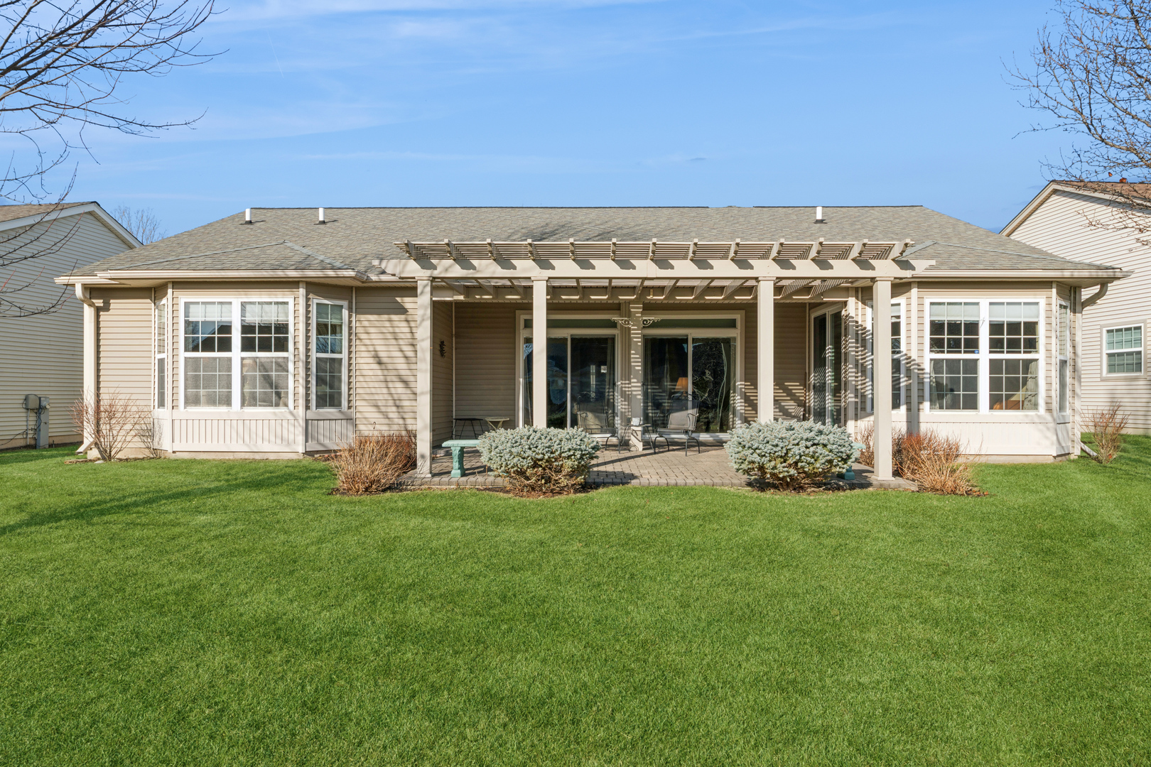 2545 Edgewater Drive Elgin, IL 60124 - Photo 21 of 21 a front view of a house with a garden and yard