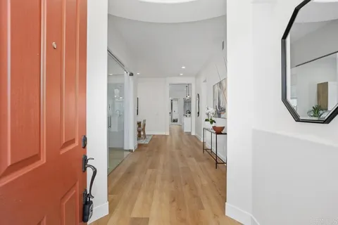 a view of a living room with a wooden floor