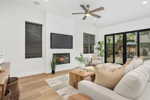 a living room with furniture fireplace and a flat screen tv