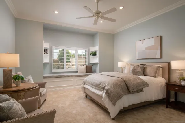 a spacious bedroom with a bed and a couch